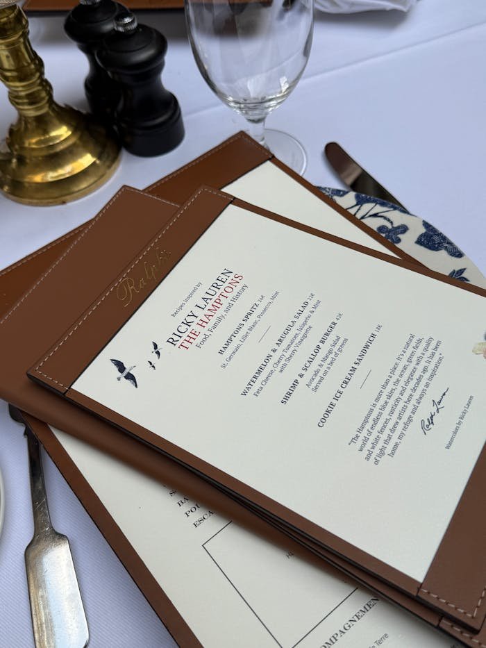 Luxurious restaurant menus and table setting with elegant decor.
